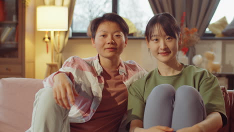 portrait of asian lesbian couple at home