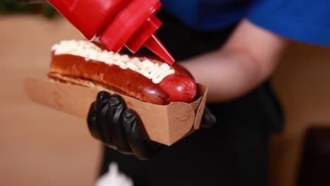 preparing a delicious hot dog