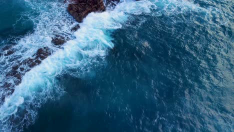 Waves-With-Foam-Splashing-On-Rocky-Coast-In-Arteixo,-Spain---aerial-drone-shot