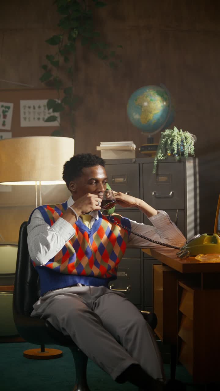 Man on Retro Phone in Vintage Office