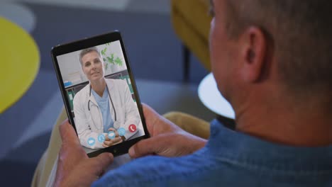 Senior-man-having-a-video-chat-on-his-digital-tablet-at-home