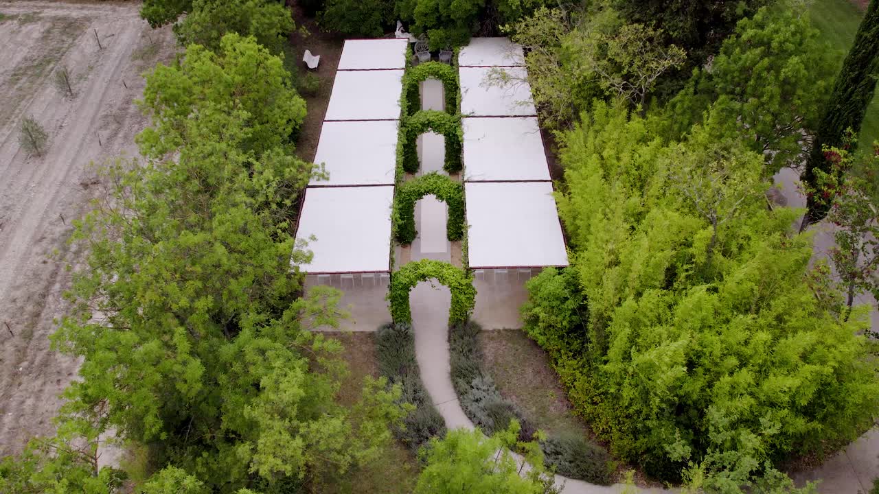 Aerial view of a garden pathway leading to an outdoor event space