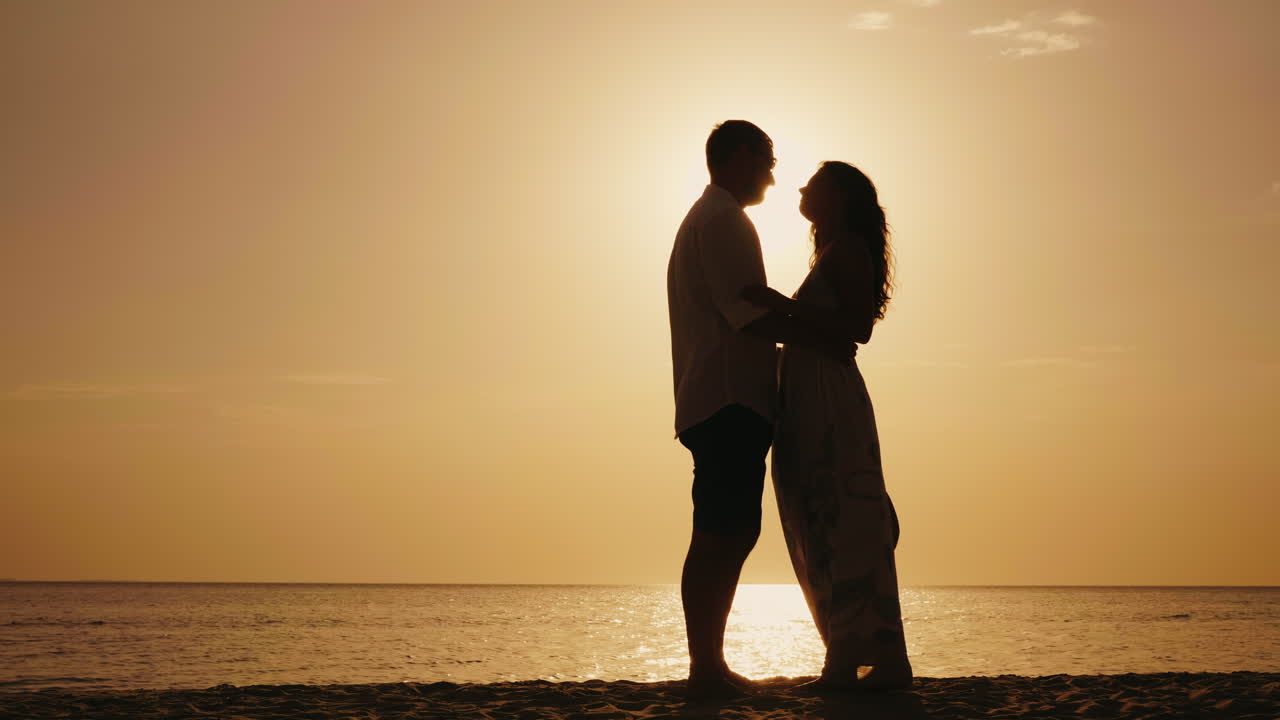 Romantic Young Couple Kissing At Sunset Against The Sea 4k Slow Motion Video  Free Stock Video Footage Download Clips Water