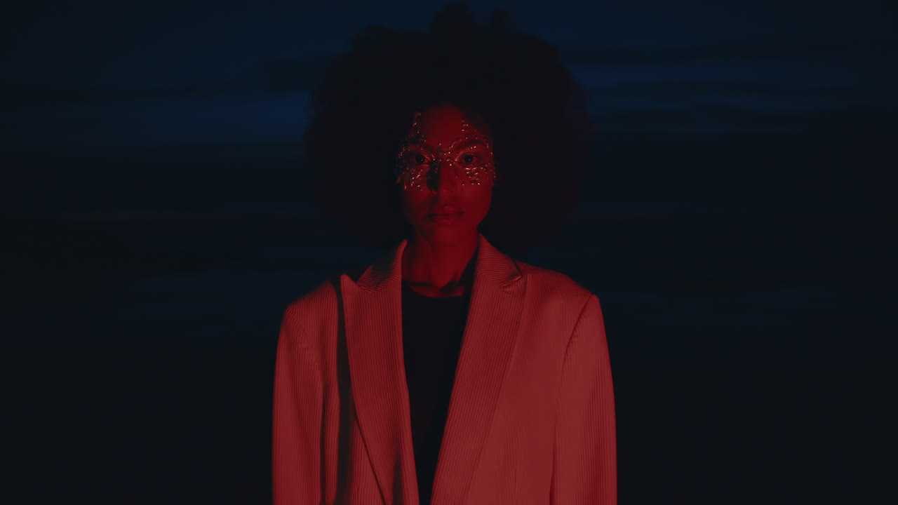 modeling night in pink light. Portrait fashion woman on beach