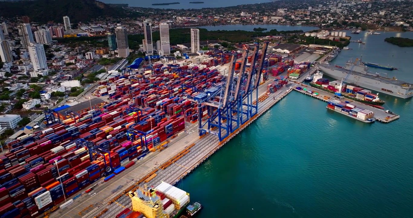 Cartagena port filled with colorful containers and drone view of blue cranes