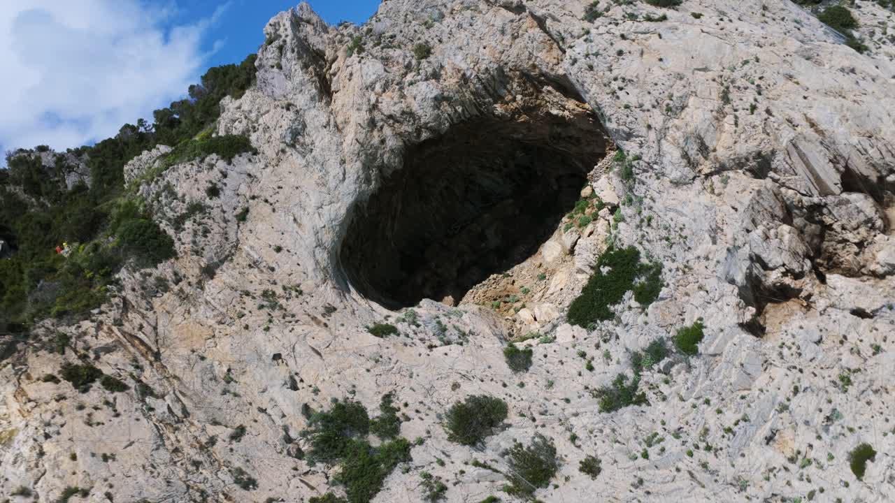 Grotta dei Falsari Cave At Capo Noli In Liguria, Italy. - aerial rotating shot
