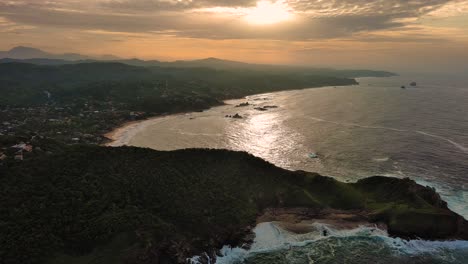 aerial drone above mazunte sunrise ocean shore beach punta cometa oaxaca mexico