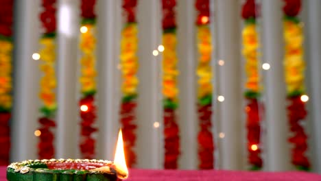 closeup shot of a beautiful light up clay oil lamp on the festival of raksha bandhan or diwali