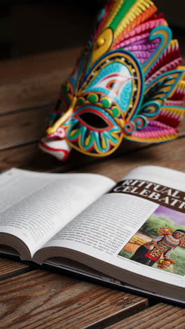ritual celebration mask and book