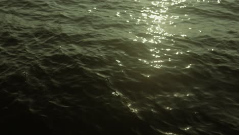 Sunlight-reflecting-on-water's-surface-in-the-evening