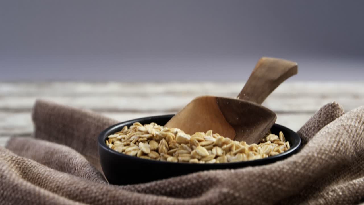 Bowl of oats with spoon and napkin