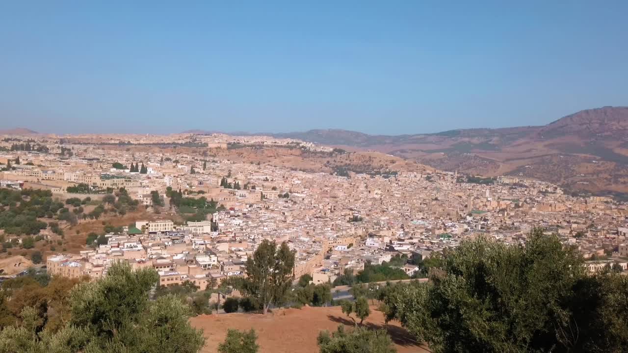 Morocco, Fes, view of the country's cultural capital city from distance during daylight with clear blue sky