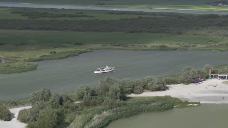 vessel cruising through ijsselmeer during a summer day, aerial