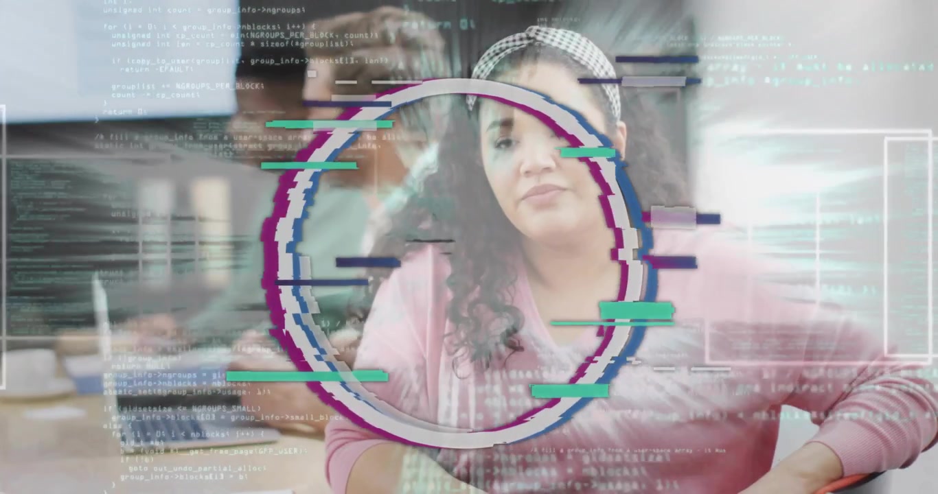 Vertical video: Glitch appearing, woman in pink headband gesturing at meeting table with laptops
