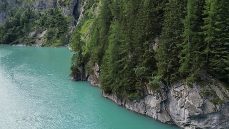 Birds-view-of-vibrant-nature-scenery-filled-with-broken-rocky-hills-and-deep-blue-water-lake-ocean-fitting-place-for-relaxation-and-peaceful-meditation-out-of-the-city-in-the-wilderness-valley