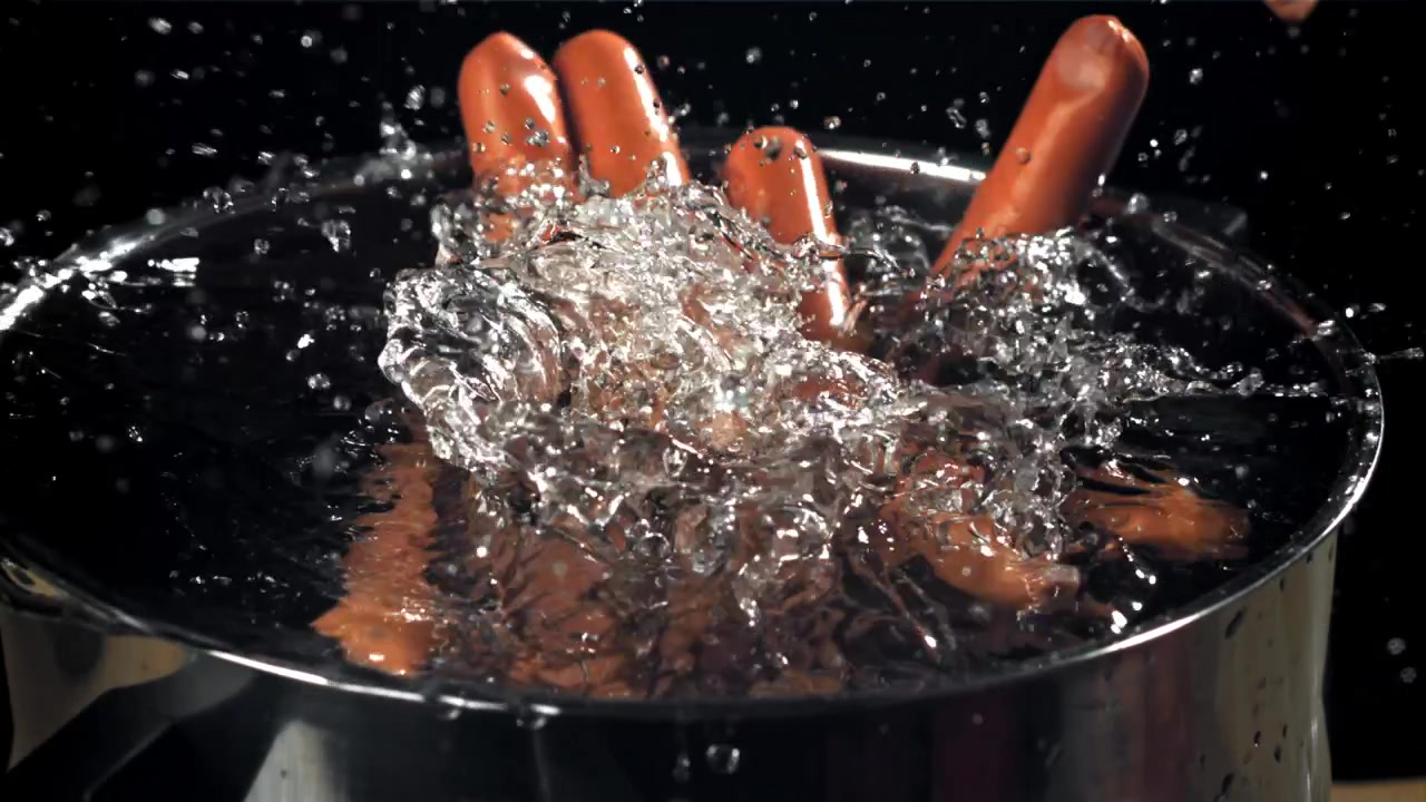 Hot Dogs Falling into Boiling Water in Slow Motion