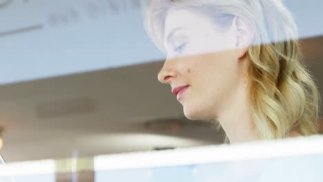 woman smiling watching her tablet