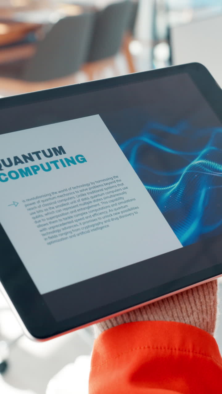 Person Holding Tablet Displaying Quantum Computing Presentation