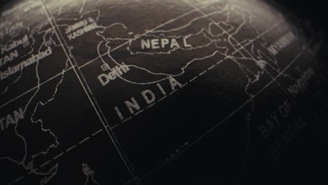 close-up of a world globe, focusing on india and nepal