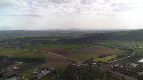 Beautiful-view-over-green-fields-and-road-in-rural-spain