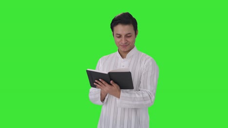 Happy-Indian-man-reading-a-book-Green-screen