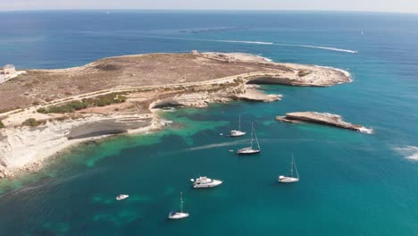 Aerial-drone-video-from-eastern-Malta,-Marsaxlokk-area,-Il-Hofra-l-Kbira-bay