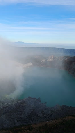 Aerial view of Kawah Ijen Volcano, cloudy sky over East Java's landscape
