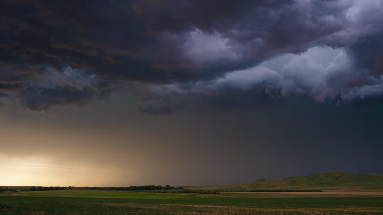 Stormy Landscape with Dark Clouds and Approaching Rain