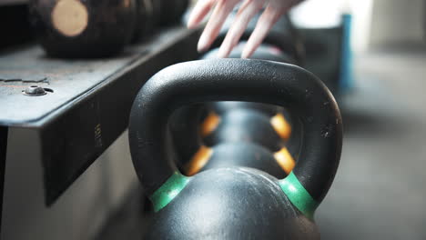 Weights,-closeup-and-hand-at-the-gym-for-fitness