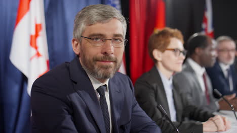 portrait of middle aged political leader at press conference