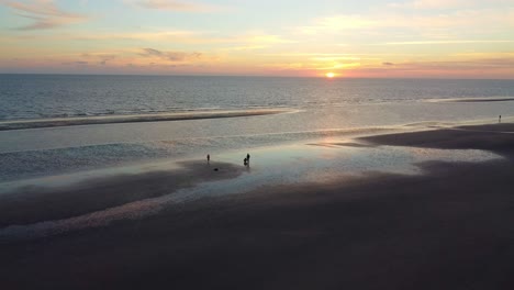 drone shot beautiful sunset and sand beach on coast of romo island