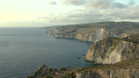 flying over the huge zakynthos coastal cliffs on the west side at sunset near keri cliffs