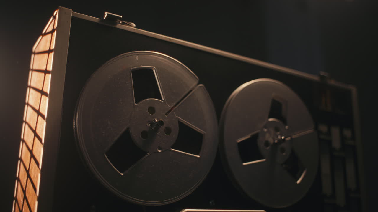 A vintage tape recorder in a pulsing light