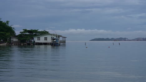 calm breeze flows through the fisherman stilt houses built on the sea in thailand