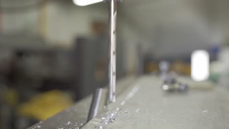 Closeup-Of-A-Drill-Bit-Spinning-In-A-Industrial-Mill,-Metalworking-Machine