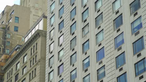 new york city skyscrapers facades, windows reflection motion shot - low angle