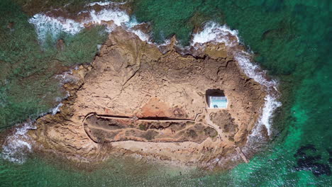 Aerial-View-Of-A-Cute-Little-Island-With-A-Little-Chapel