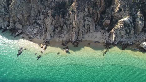 crystal-clear turquoise waters by the beach in cabo san lucas marina