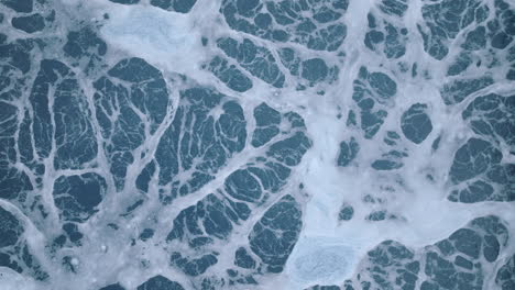 close static aerial footage of a chemical pool that slowly rises