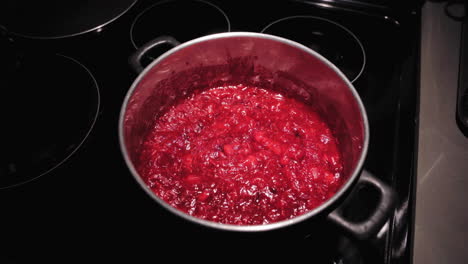 cranberry sauce cooking on the stove, close up view