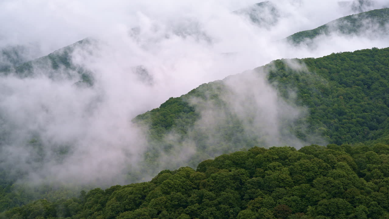 Smoky ridges vanish into the fog in this aerial shot