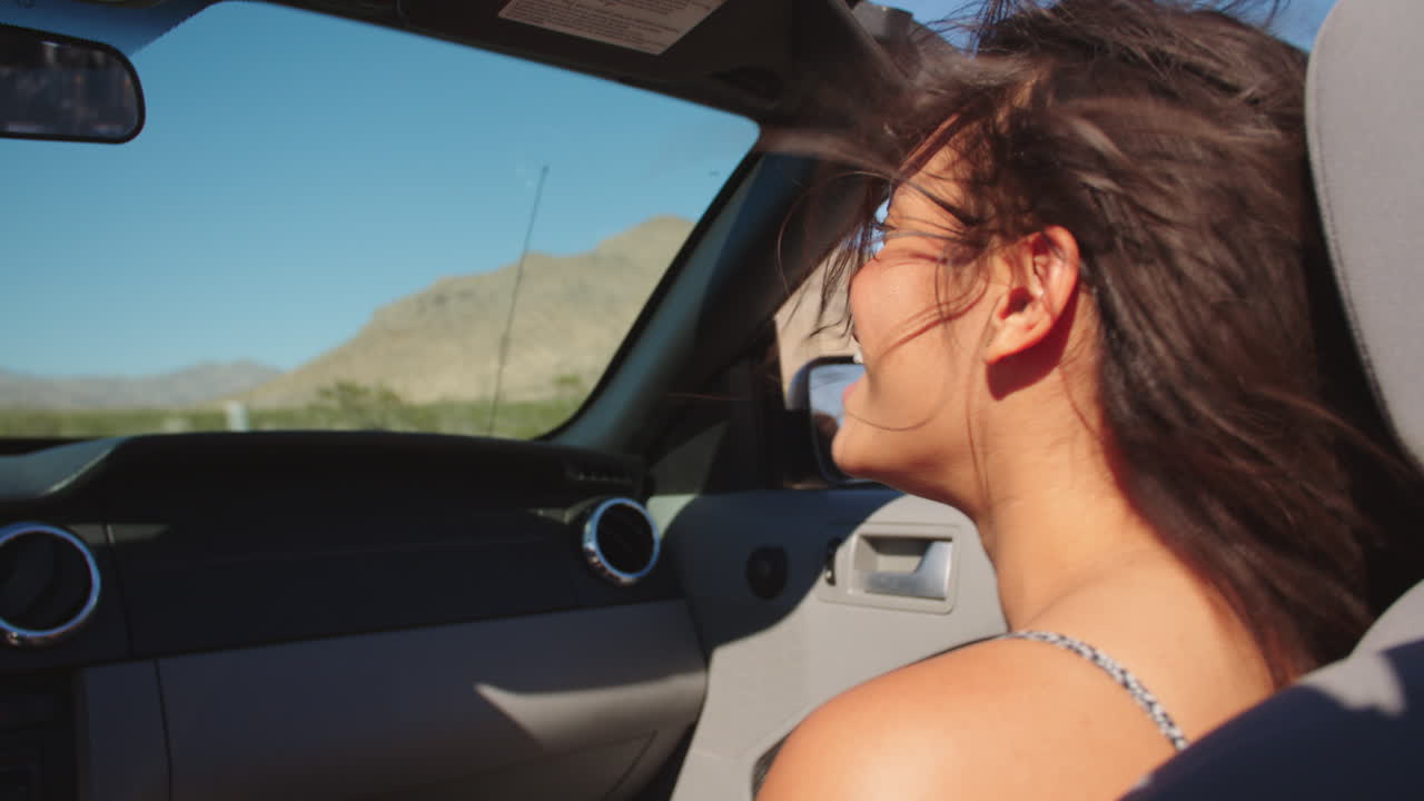 Female Passenger Driving In Convertible Car Shot On R3D