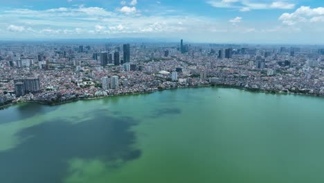 cinematic aerial footage of hanoi in vietnam with the tay ho lake in the foreground, shot on a mavic 3 classic in 4k, drone, asia