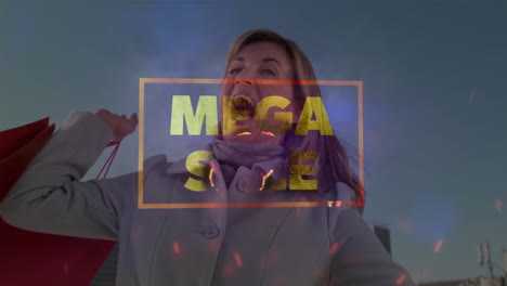 mega sale text banner and red particles floating against caucasian woman with shopping bags