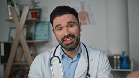 healthcare worker communicating web conference closeup. smiling man consulting