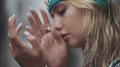 woman with tribal headband and face paint