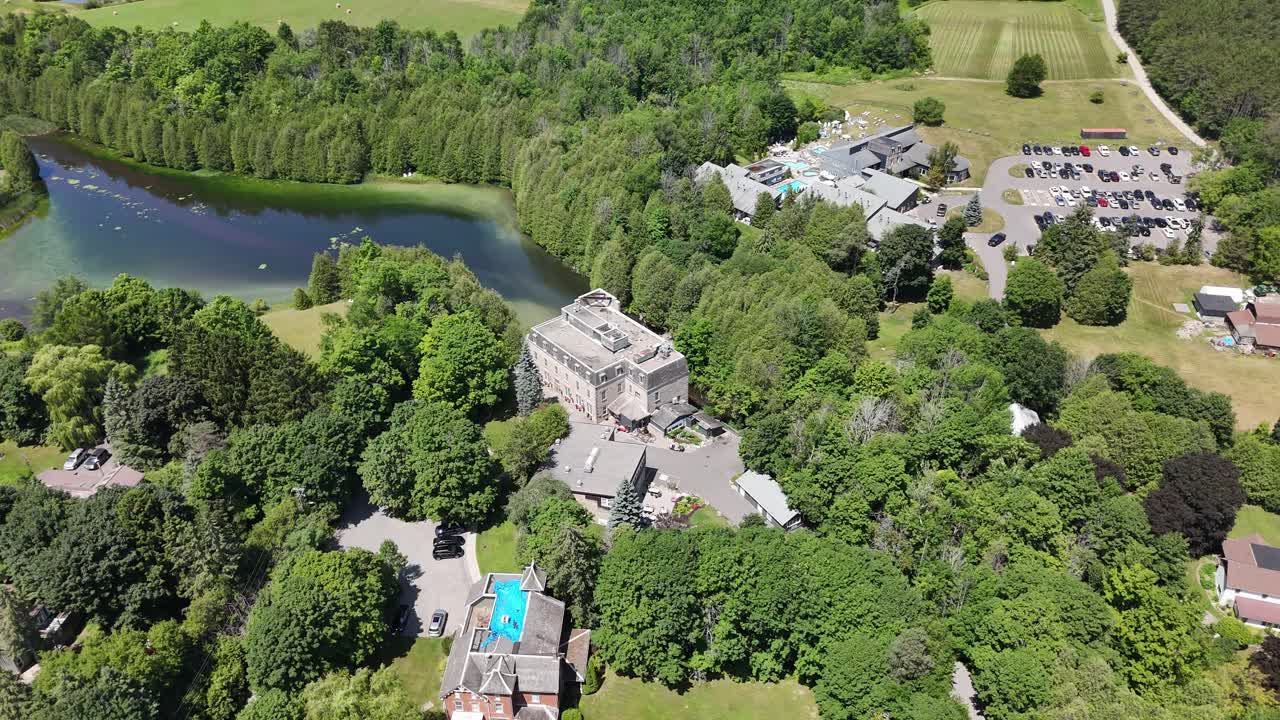 Drone orbit of Millcroft Inn and Spa complex with gardens in Alton, Caledon