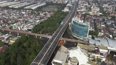 aerial of densely populated area in downtown jakarta, indonesia - drone shot
