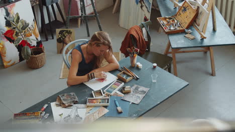 woman painting in an art studio