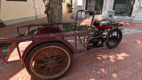 stationary motorcycle with sidecar on a brick path